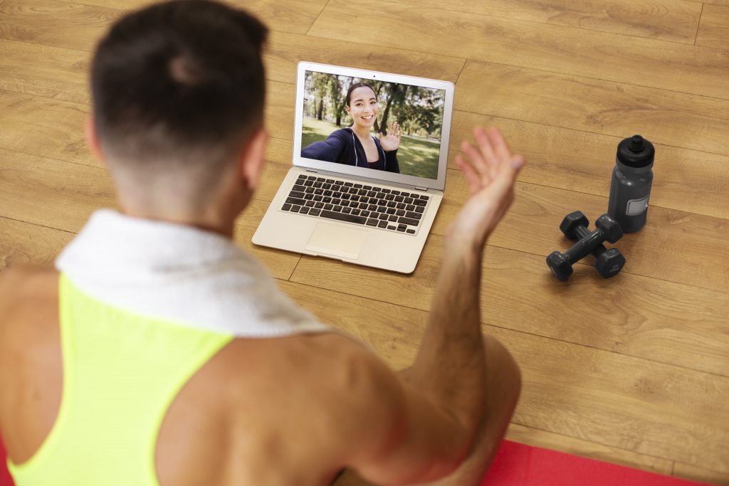Online Fitness Trainer with Laptop
