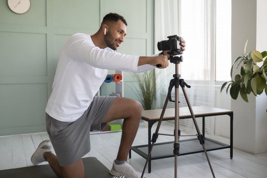 Online Personal trainer setting up the camera