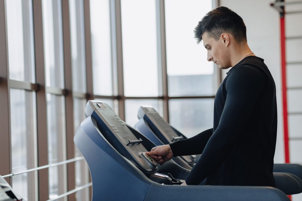 Coach running on tradmil