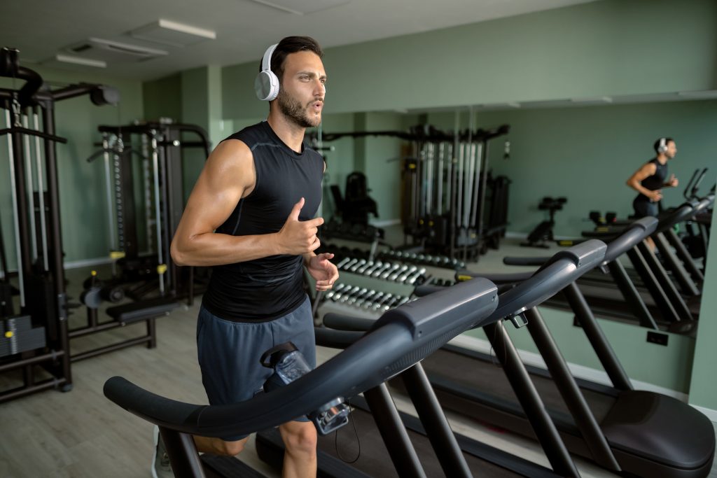 Personal Trainer running on Tradmil